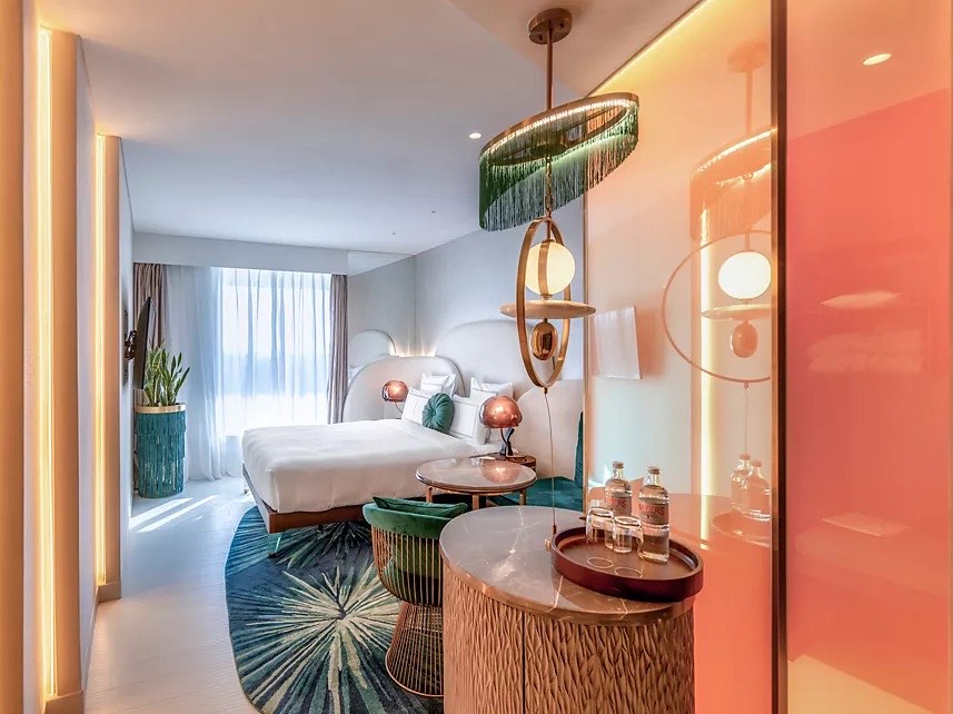 Guest room with fringe pendant lighting at Gem Forest