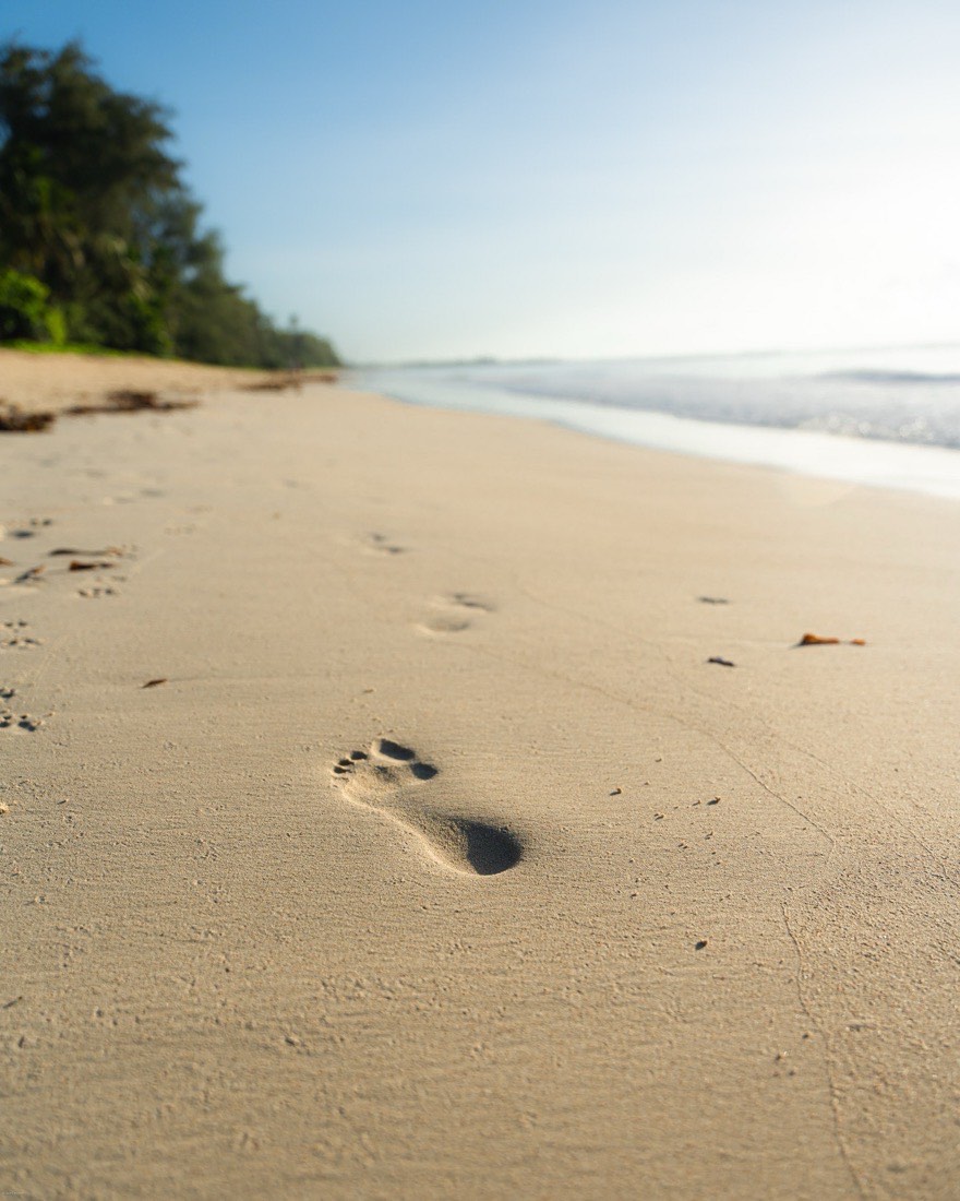 Footprints in the sand on a beach near Kaya Imani