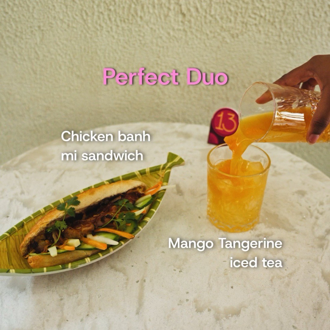 Chicken banh mi sandwich and mango tangerine iced tea at Okia