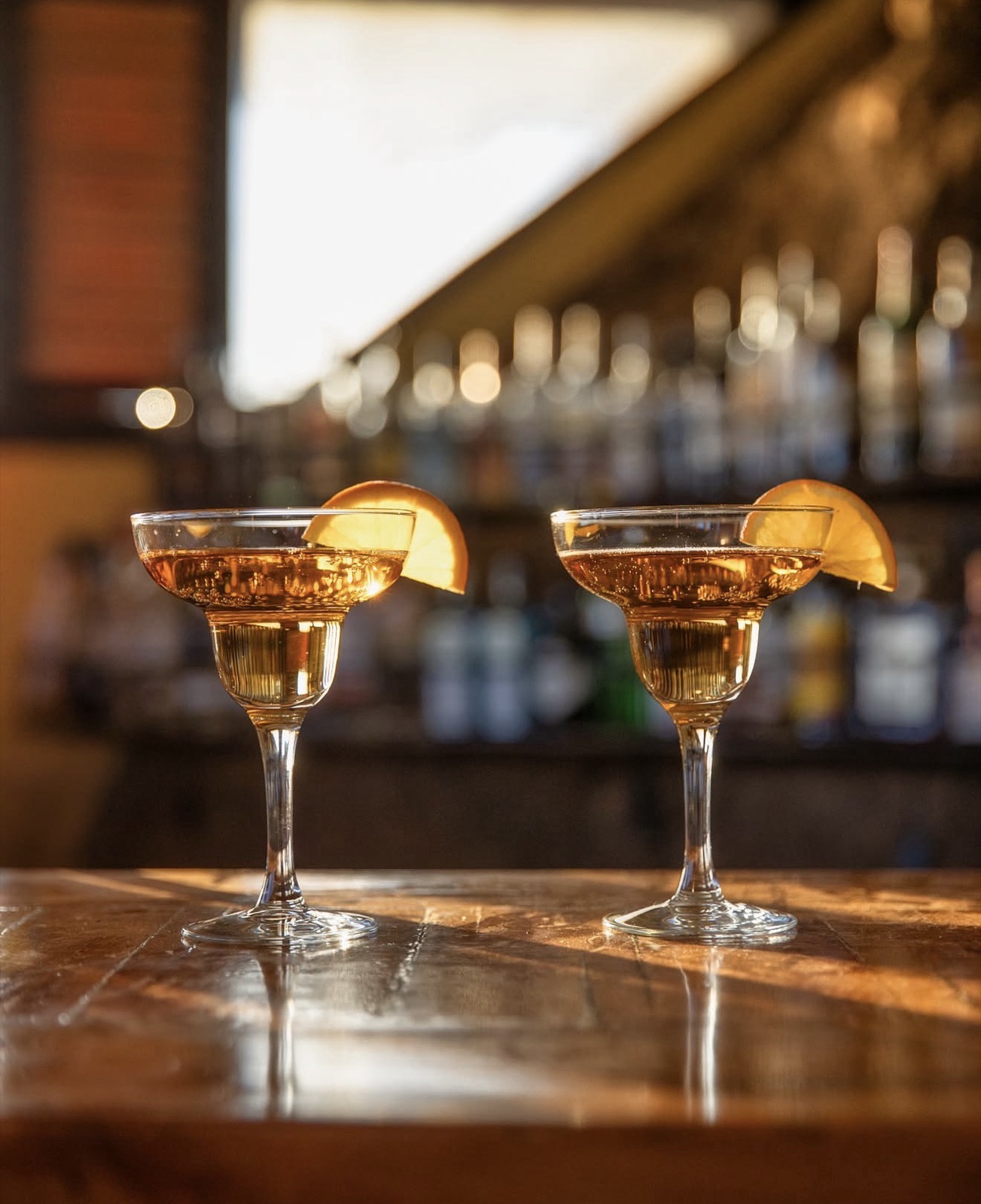 Two cocktails on the bar counter