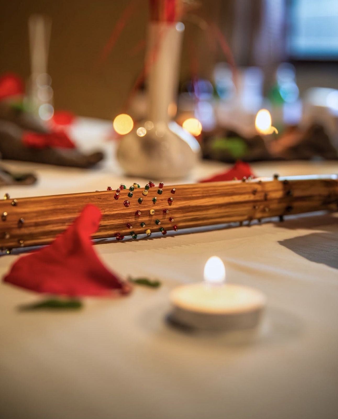 Spa setting with candles and a folded towel